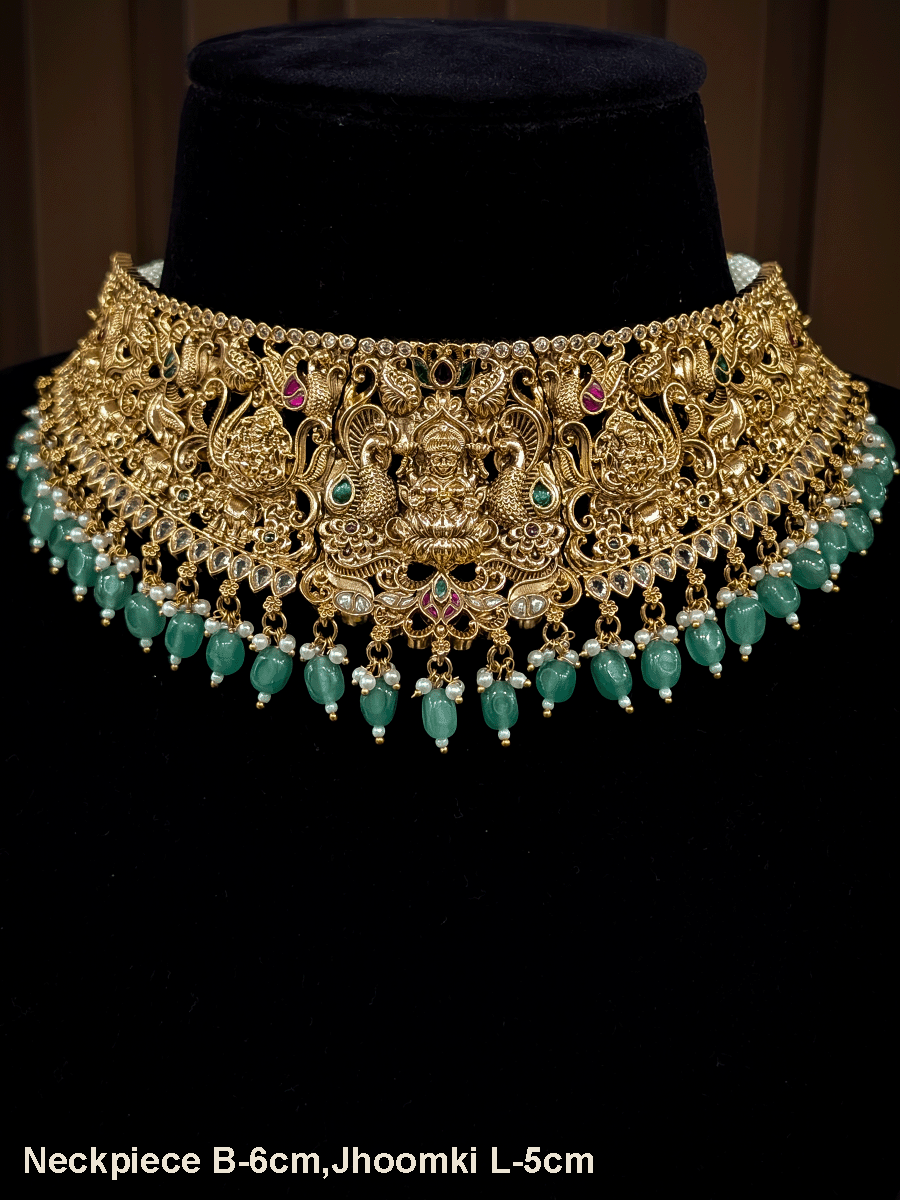 6cm broad kundan and polki studded laxmiji set with peacock design on both sides and jade bead drops
