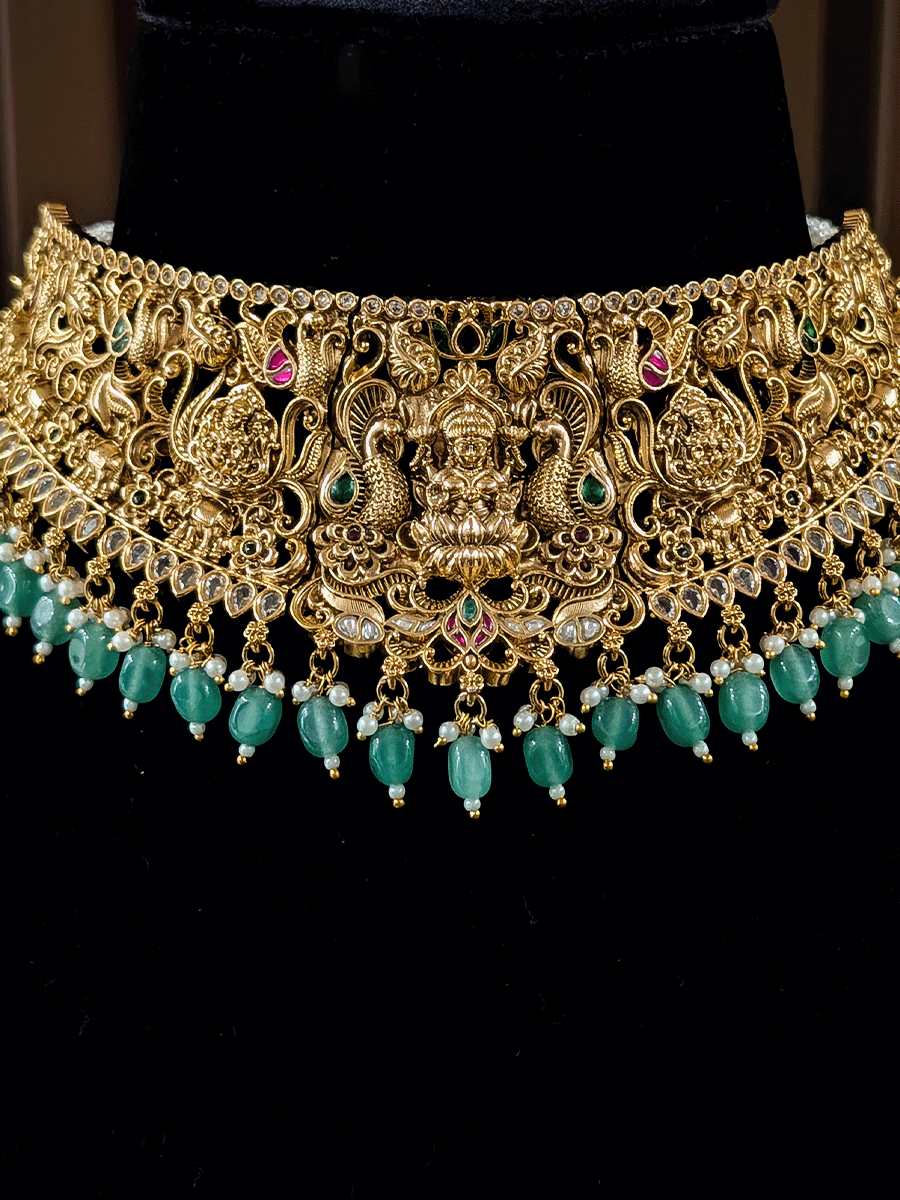 6cm broad kundan and polki studded laxmiji set with peacock design on both sides and jade bead drops
