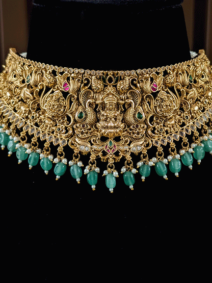 6cm broad kundan and polki studded laxmiji set with peacock design on both sides and jade bead drops