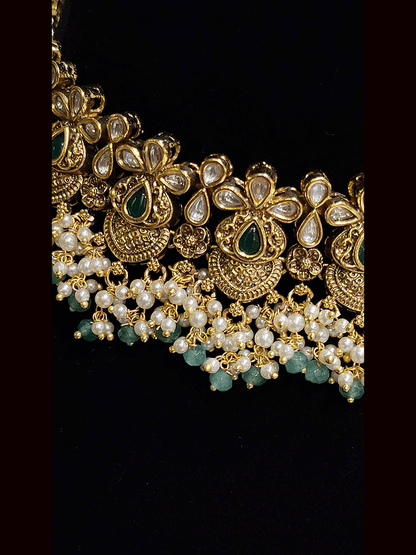 Intricate design antique gold finish kundan and stones studded pearly frill set