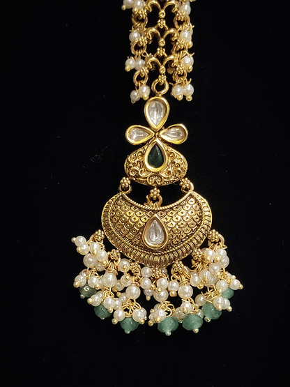 Intricate design antique gold finish kundan and stones studded pearly frill set