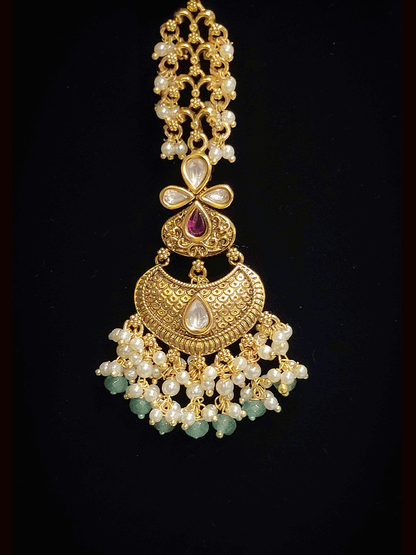 Intricate design antique gold finish kundan and stones studded pearly frill set