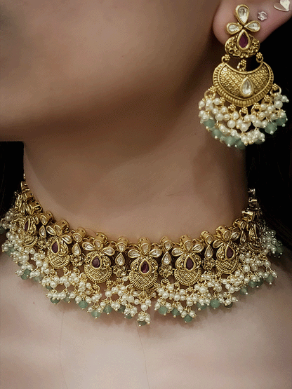 Intricate design antique gold finish kundan and stones studded pearly frill set