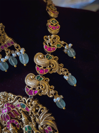 Pink and green stones studded 10" long string Ram durbar with peacock side string aqua bead drops paachi kundan set