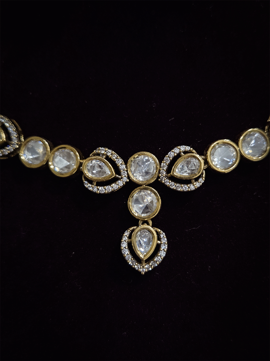 Round and tear drop shaped moissanite set with leaf AD setting