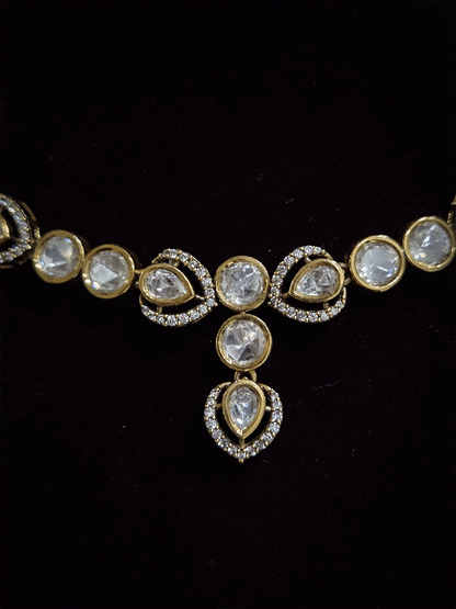 Round and tear drop shaped moissanite set with leaf AD setting