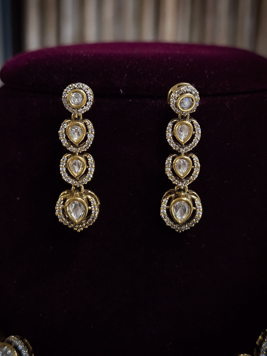 Round and tear drop shaped moissanite set with leaf AD setting