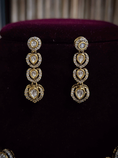 Round and tear drop shaped moissanite set with leaf AD setting