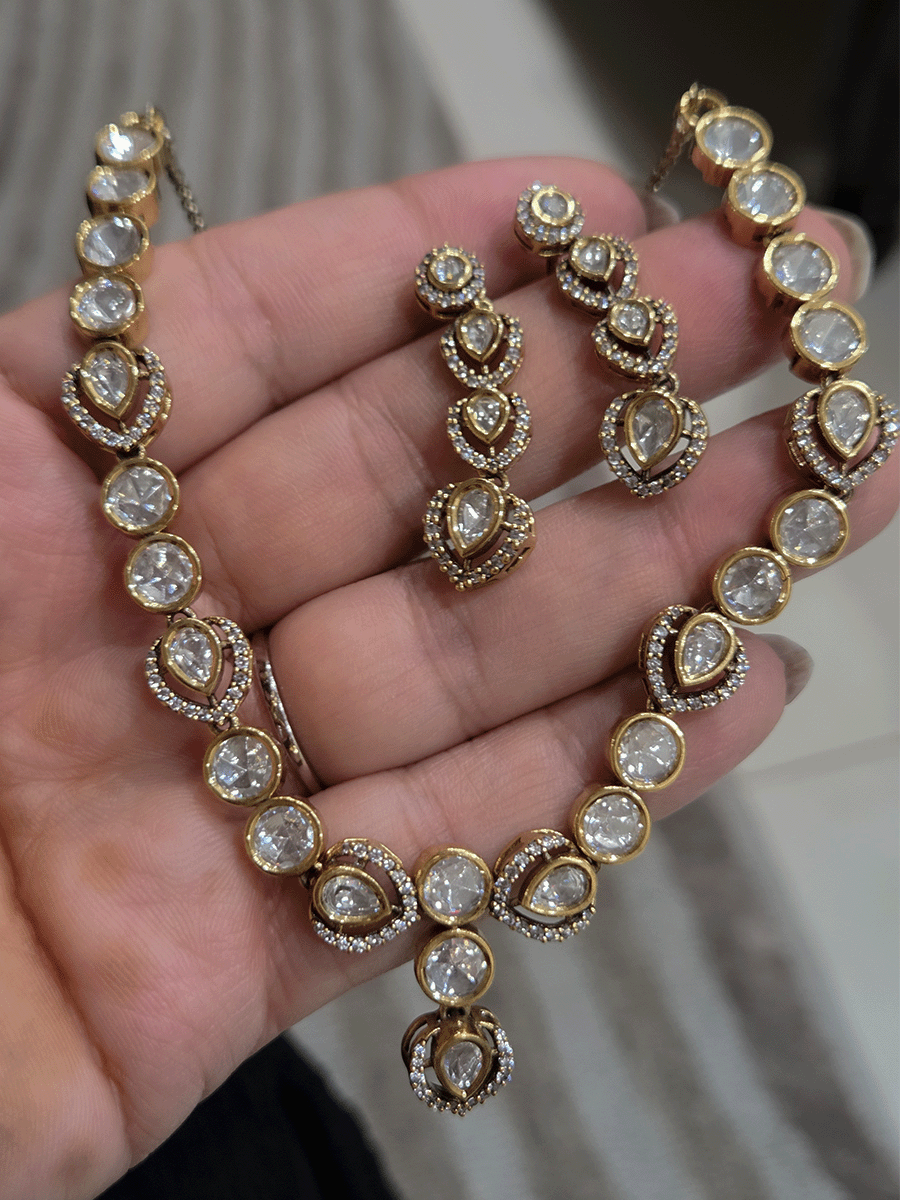 Round and tear drop shaped moissanite set with leaf AD setting