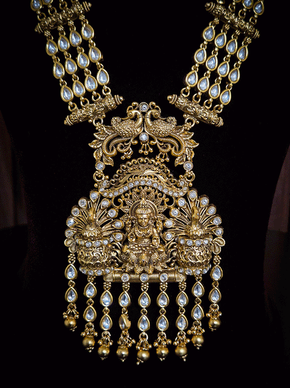 Kundan studded laxmiji with peacock on sides long pendant set with 2cm broad kundan string