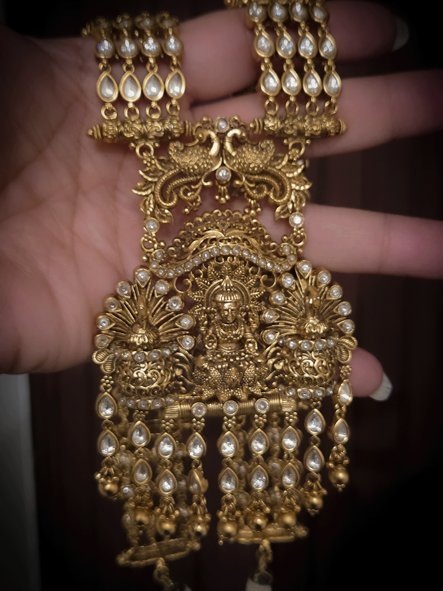 Kundan studded laxmiji with peacock on sides long pendant set with 2cm broad kundan string