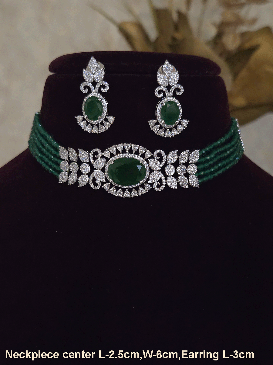 Oval coloured stone in center with AD leaf design and onyx side strings set