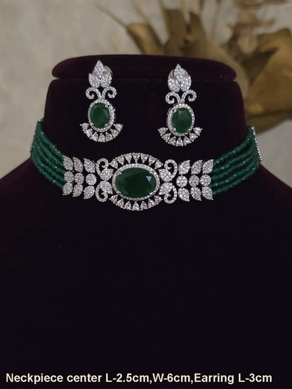 Oval coloured stone in center with AD leaf design and onyx side strings set