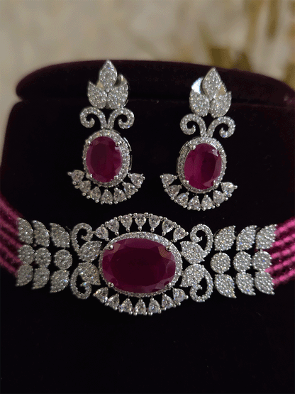 Oval coloured stone in center with AD leaf design and onyx side strings set
