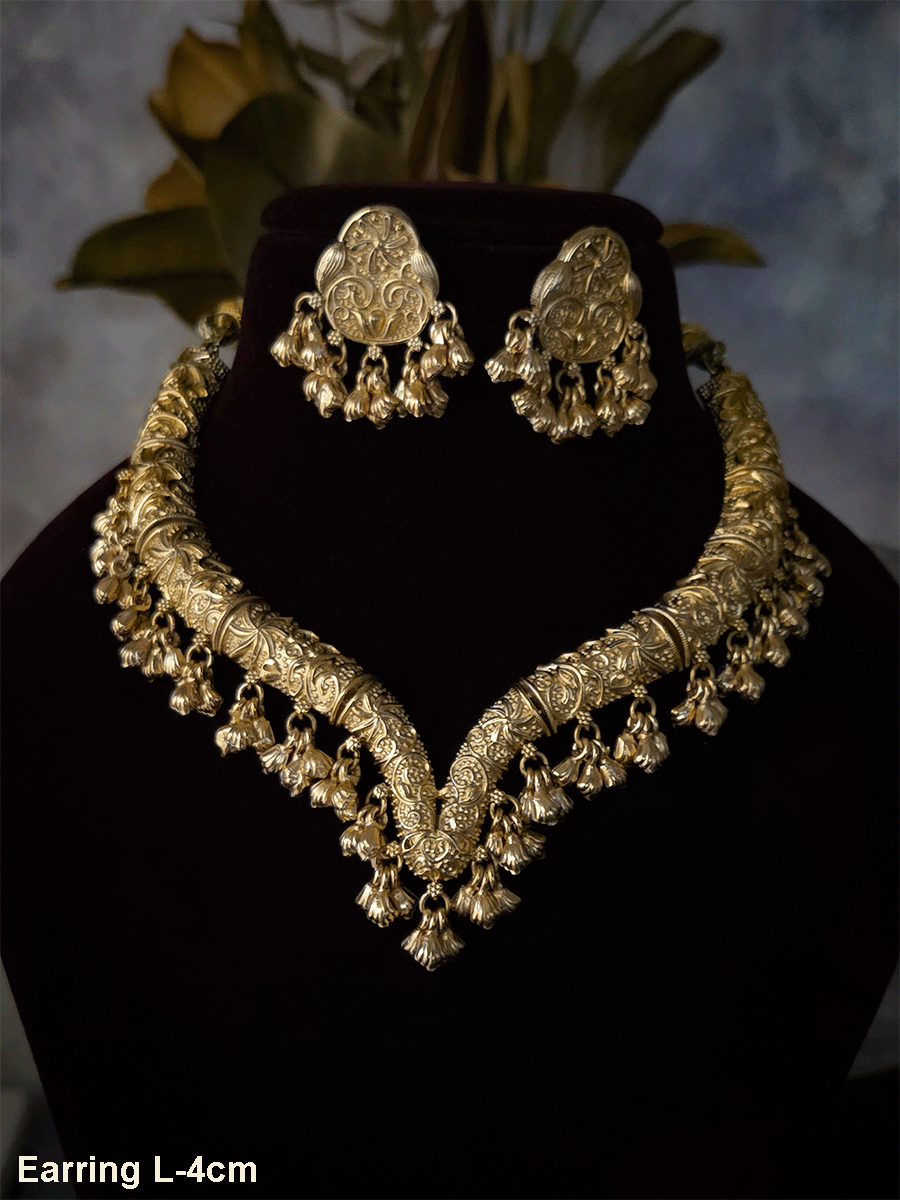 Gold finish self design hasli neckpiece with ghunghru hangings