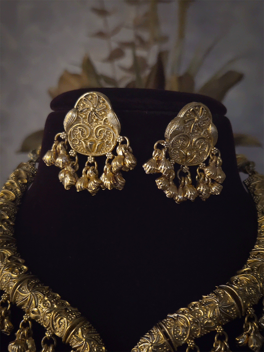 Gold finish self design hasli neckpiece with ghunghru hangings