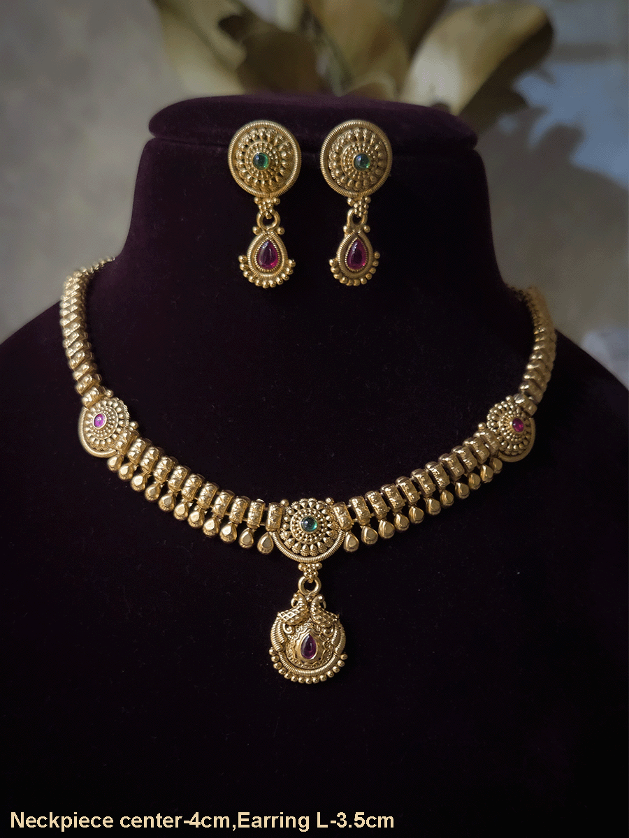 Circular tukdies with coloured stones sleek set with hanging tear drop shaped peacock tukdi in center