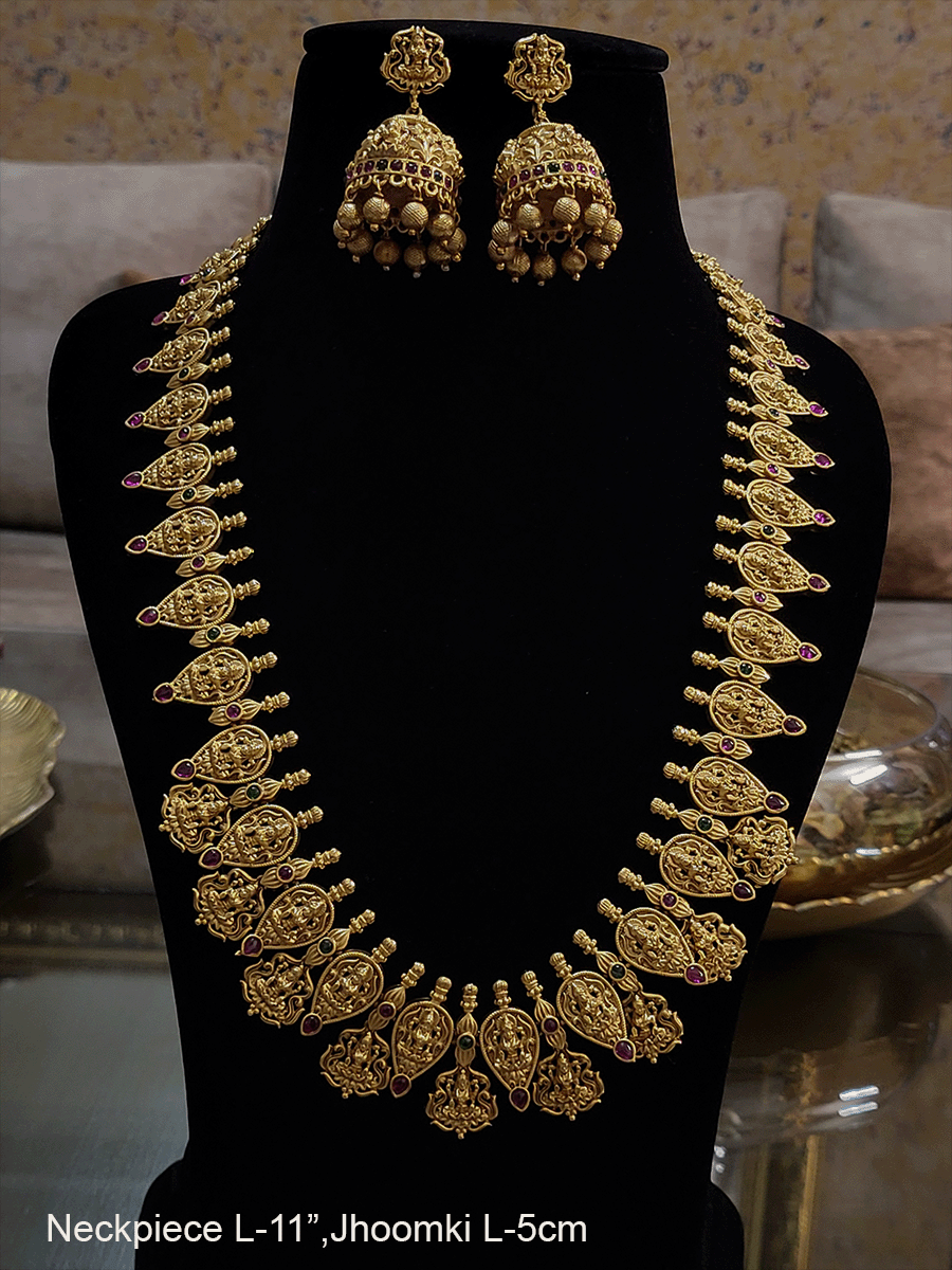 Long gold plated laxmiji motif's in leaf design tukdies set with ruby and green stones