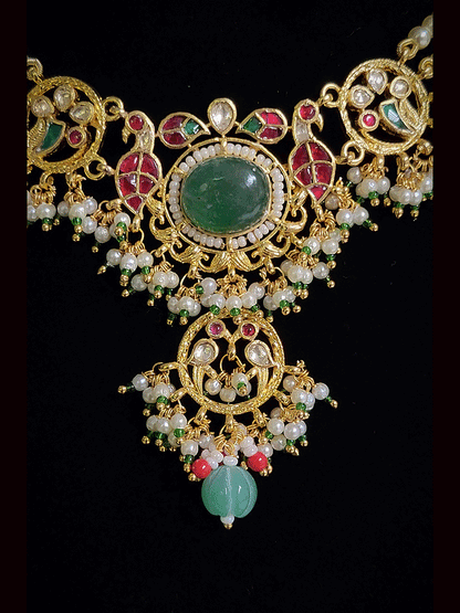 Aqua oval stone in the center with peacock side design aqua drops three pearl strings paachi kundan set