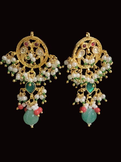 Aqua oval stone in the center with peacock side design aqua drops three pearl strings paachi kundan set