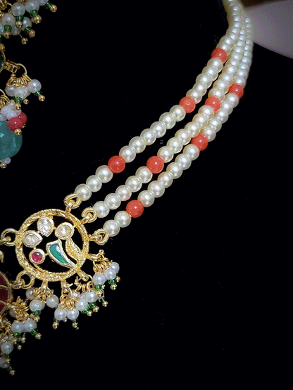 Aqua oval stone in the center with peacock side design aqua drops three pearl strings paachi kundan set