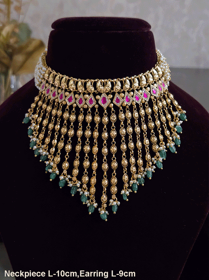 Golden tukdi tassels with green bead drops and paisley design top ruby stones set