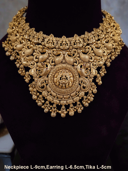 Laxmiji motif in circular design center and on neckline of peacock design broad set with ghunghru hangings