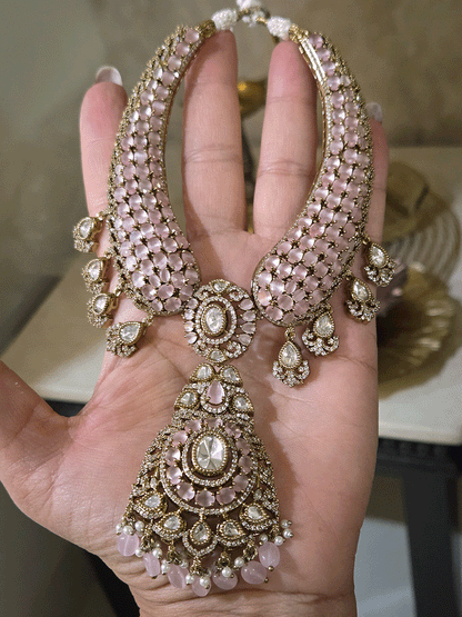 Oval shaped moissanite pendant with stones studded hasli set in mehandi finish