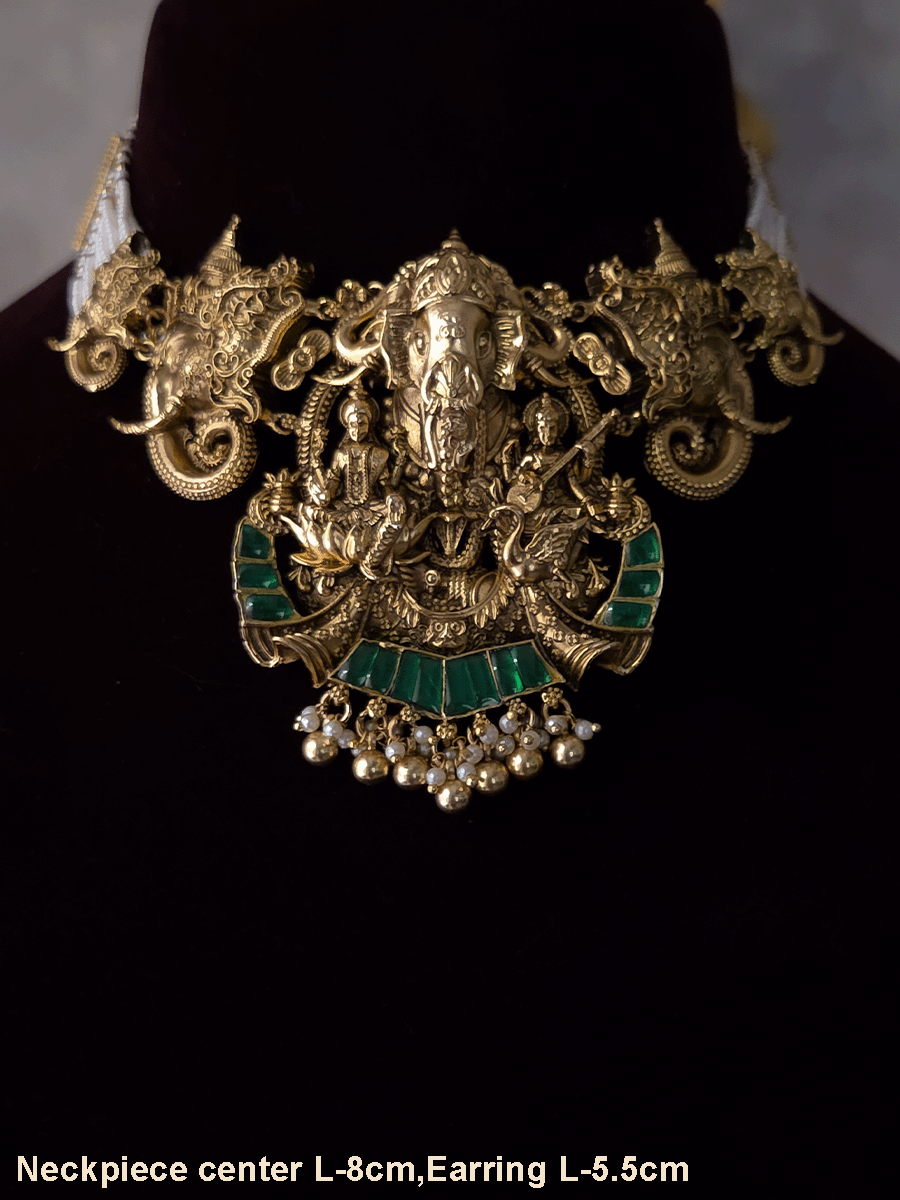 Ganpatiji with Laxmiji and Saraswatiji on both sides bold center design set with intricately carved ganpatiji faces on sides