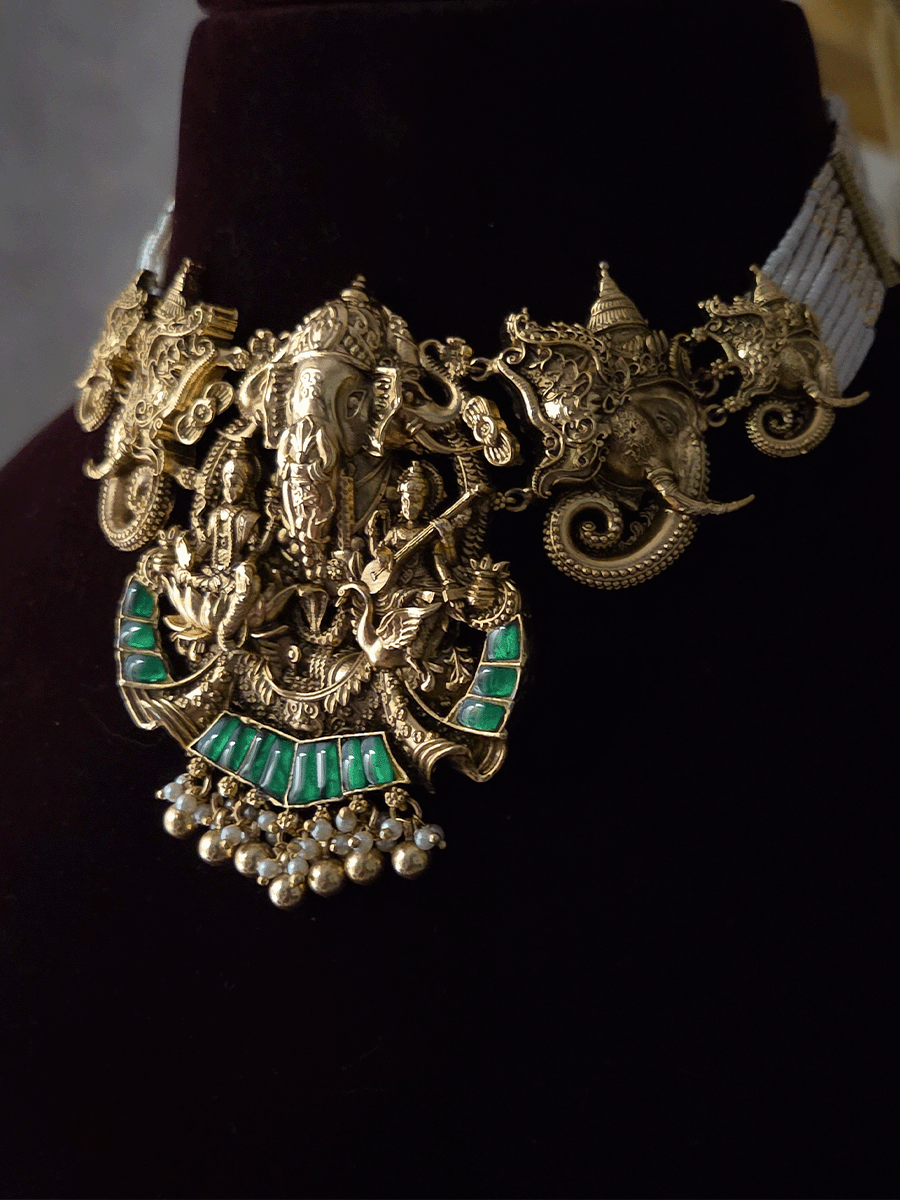 Ganpatiji with Laxmiji and Saraswatiji on both sides bold center design set with intricately carved ganpatiji faces on sides