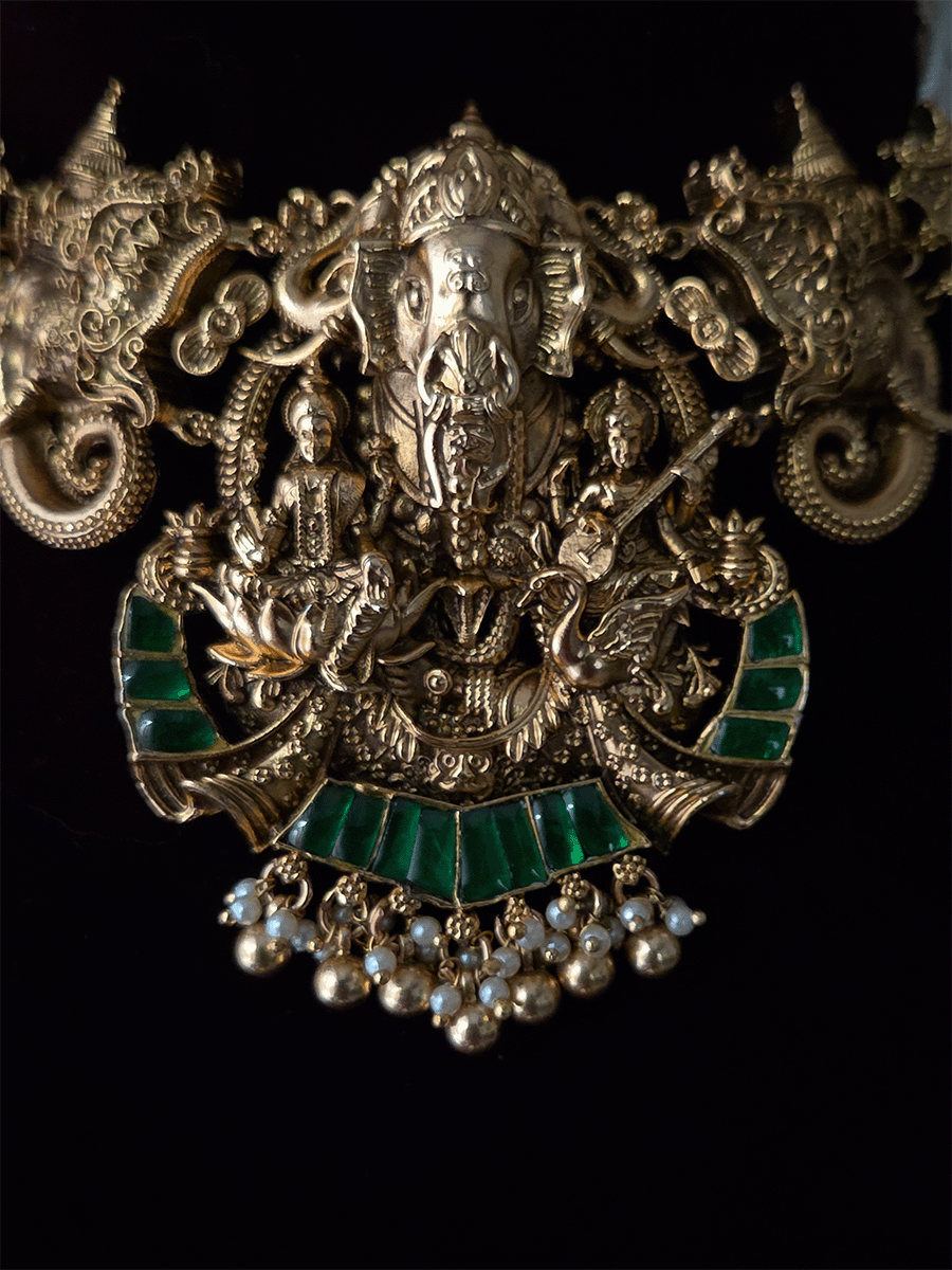 Ganpatiji with Laxmiji and Saraswatiji on both sides bold center design set with intricately carved ganpatiji faces on sides
