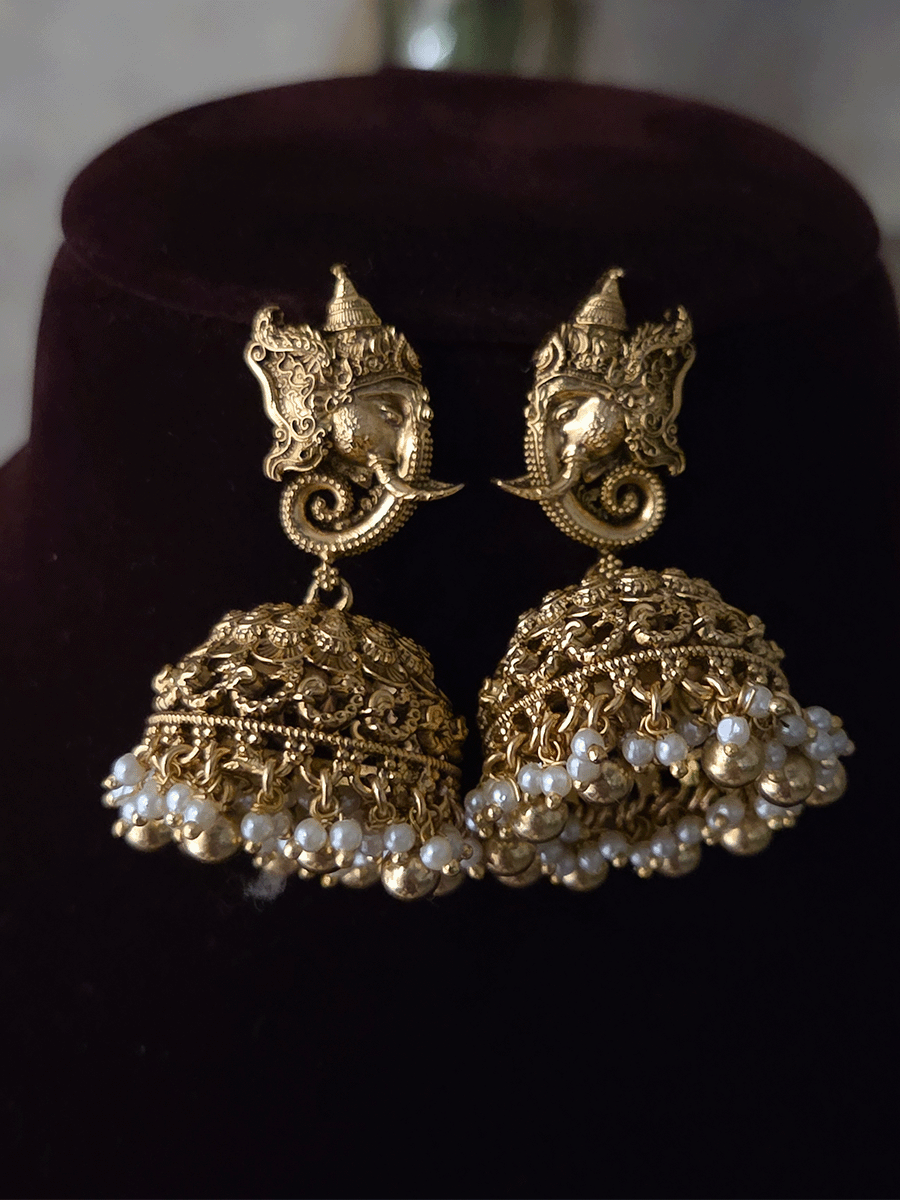 Ganpatiji with Laxmiji and Saraswatiji on both sides bold center design set with intricately carved ganpatiji faces on sides