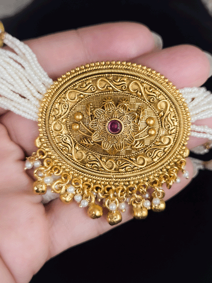 Oval center pendant with ruby stone on flower design side cheed string set