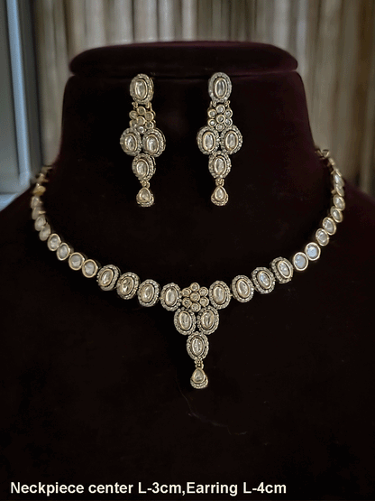 Flower in center of oval moissanite setting sleek antique gold finish set