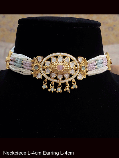 Oval kundan tukdi with ruby stone center set with side cheed strings