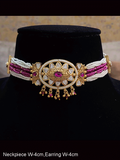 Oval kundan tukdi with ruby stone center set with side cheed strings