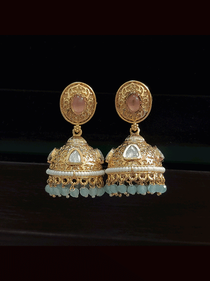 Oval kundan tukdi with ruby stone center set with side cheed strings