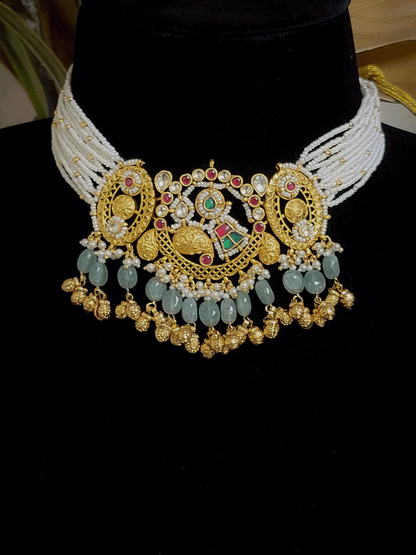 Paisley design paachi kundan center with oval side design aqua bead and ghunghru hangings set