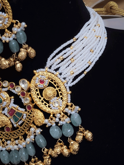 Paisley design paachi kundan center with oval side design aqua bead and ghunghru hangings set