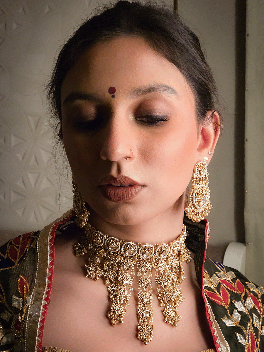 Gold finish kundan embedded set with tukdi tassel design