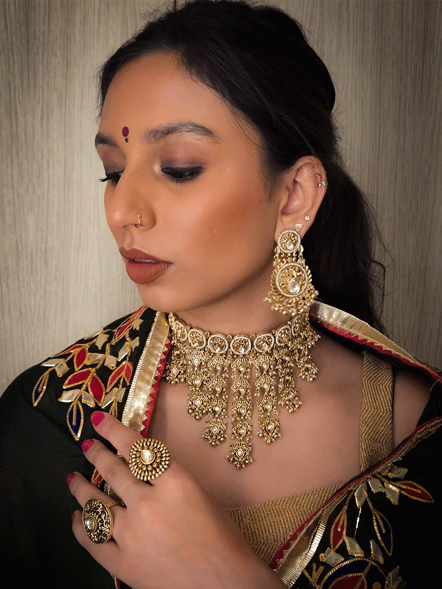 Gold finish kundan embedded set with tukdi tassel design