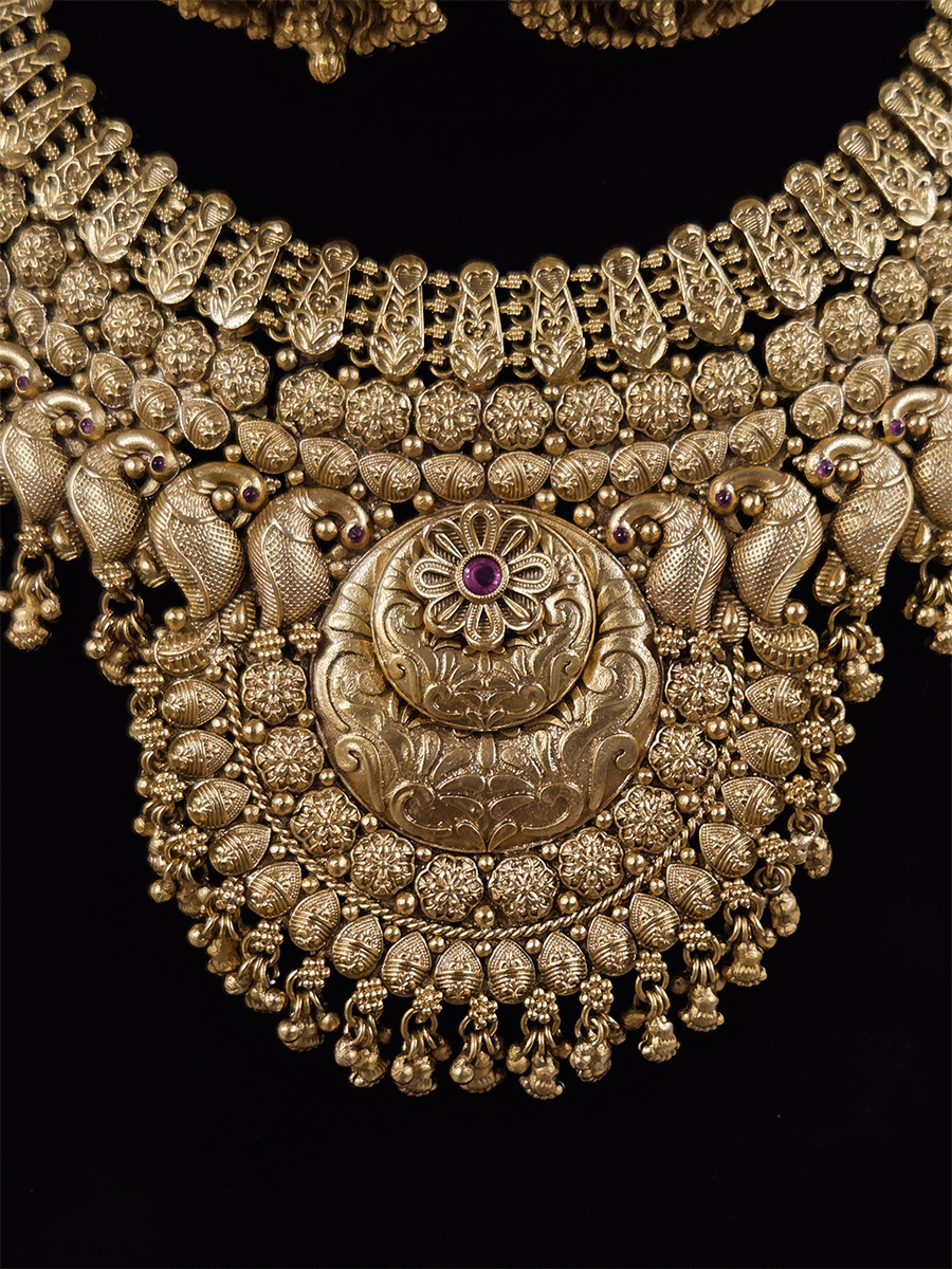 9cm circular design center with ruby stone flower broad set with peacock motif's