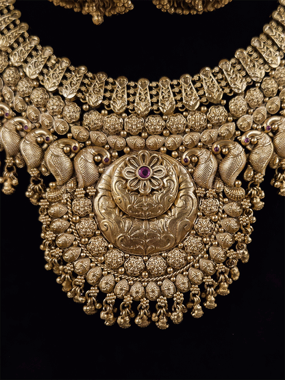 9cm circular design center with ruby stone flower broad set with peacock motif's
