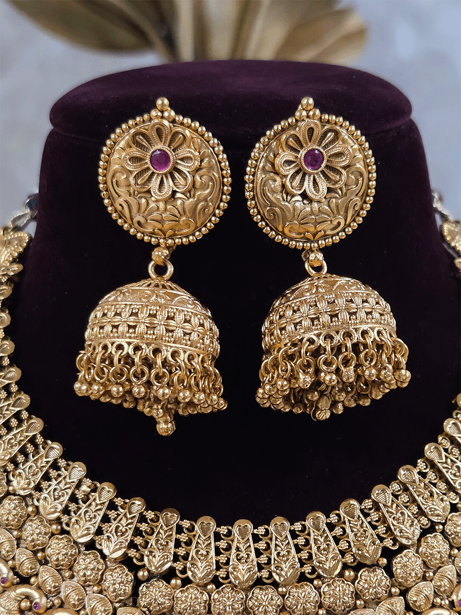 9cm circular design center with ruby stone flower broad set with peacock motif's