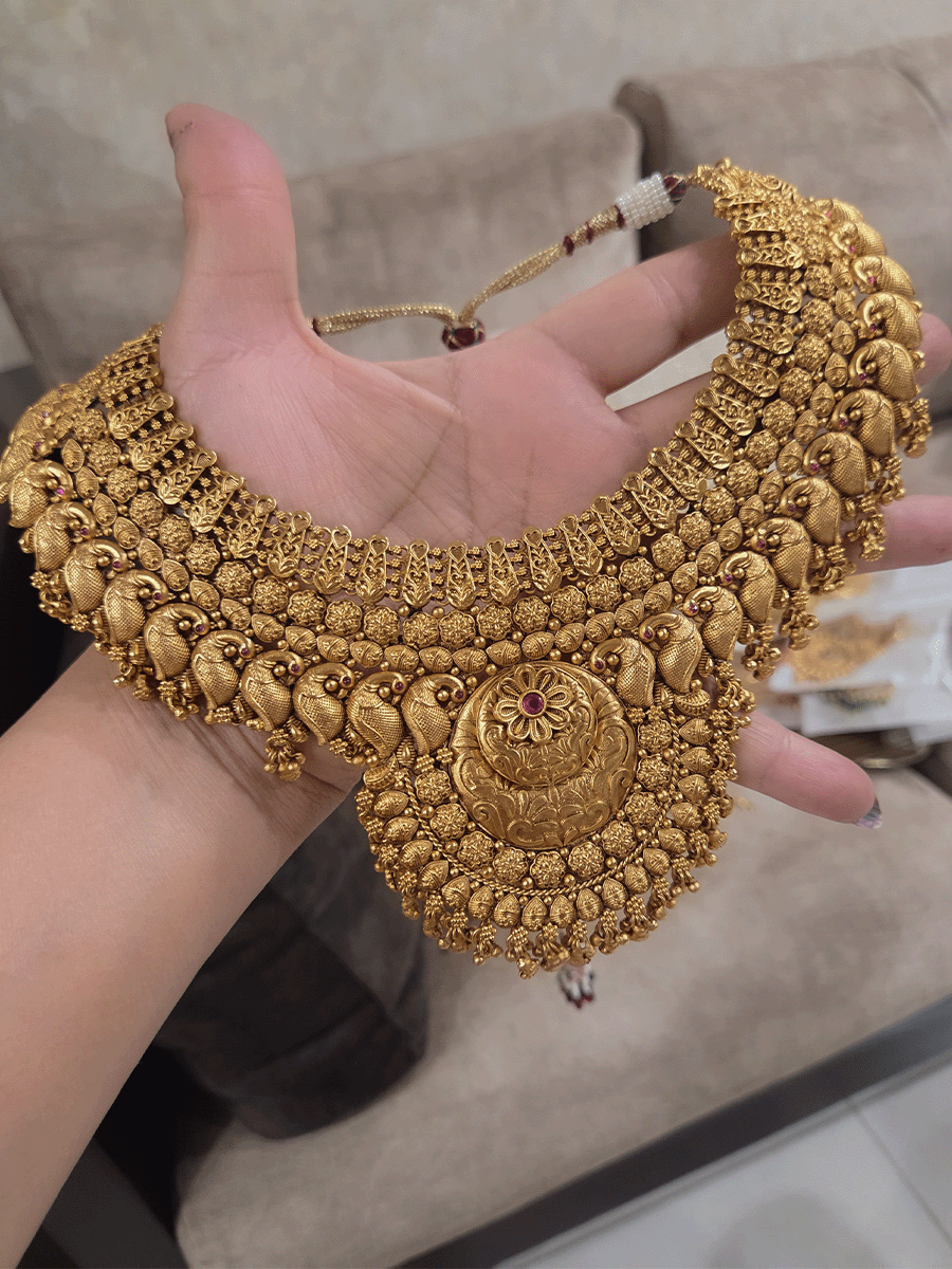 9cm circular design center with ruby stone flower broad set with peacock motif's