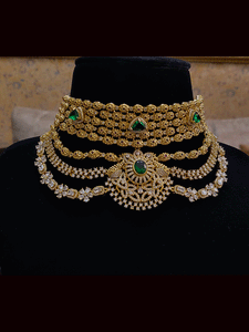 Oval tukdies with polki embedded five line top with three layer zircon and polki frill broad set