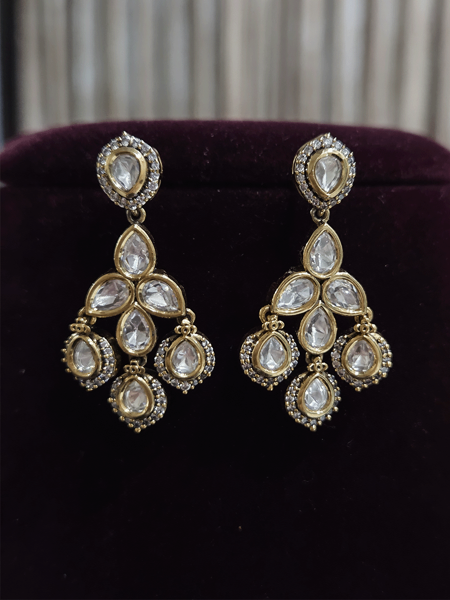 Round and tear drop shaped moissanite set with leaf shaped AD studded drops