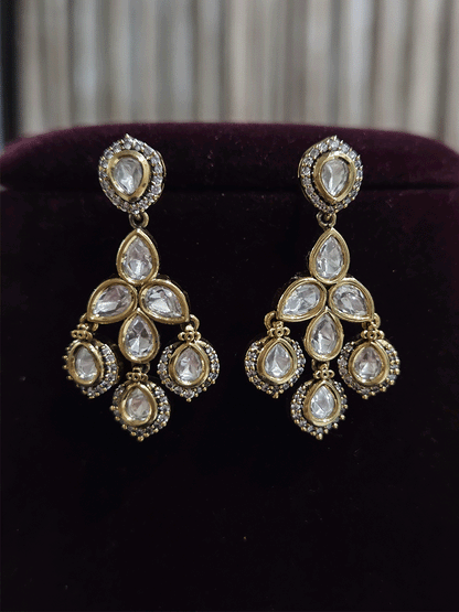 Round and tear drop shaped moissanite set with leaf shaped AD studded drops