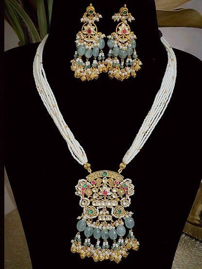 Antique gold finish 8 inch long string paachi kundan pendant set with aqua and ghunghru hangings