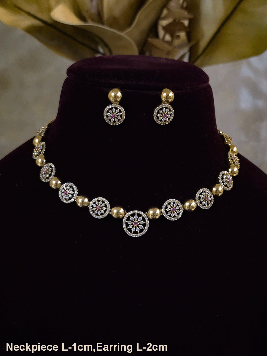 Circular zircon studded tukdies with half gold bead design sleek set
